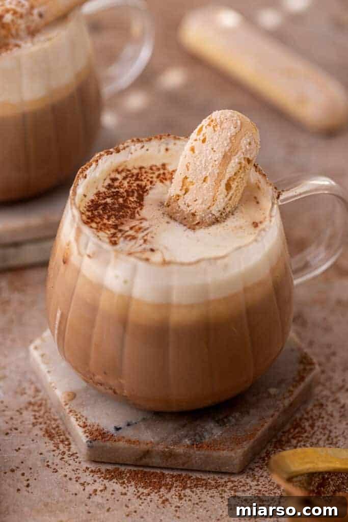 Mastering the Dreamy Tiramisu Latte Recipe 10 Creamy homemade tiramisu latte topped with mascarpone foam and cocoa powder, ready to drink.