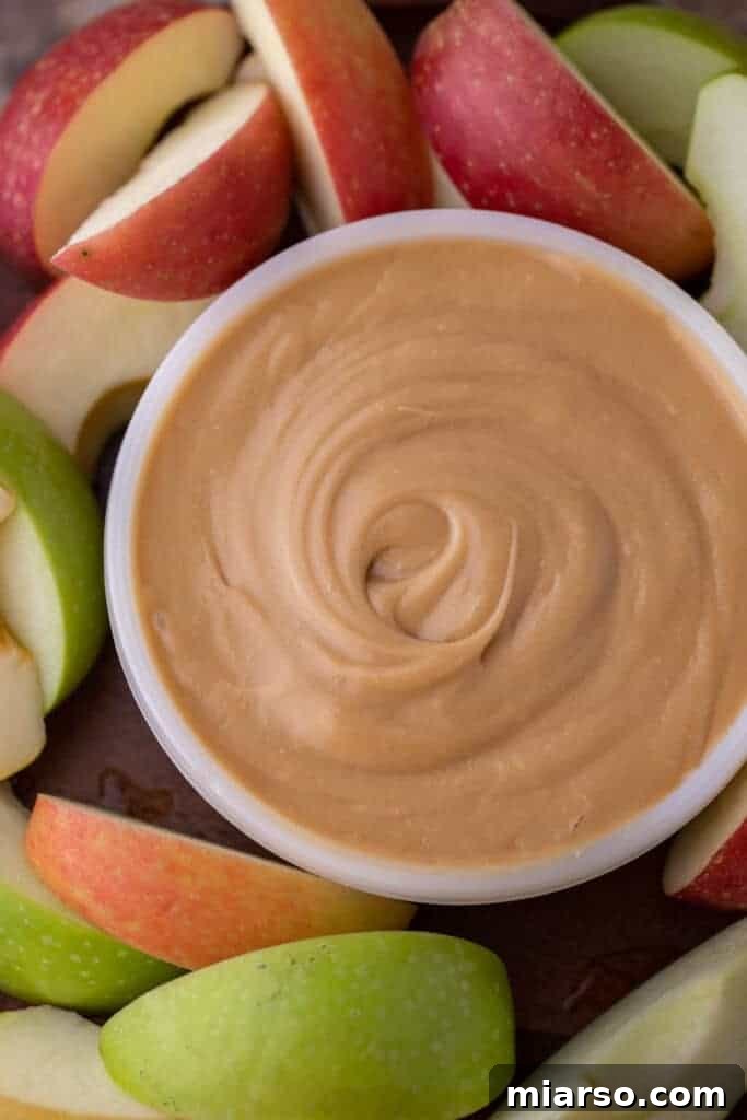 Crafting the Perfect Homemade Caramel Apple Dip 4 Overhead shot of a bowl of rich caramel dip, perfectly smooth and golden, ready for apple slices.