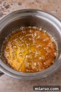 Golden caramel in a pan, showcasing the perfect amber color after cooking.