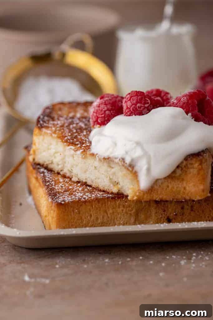 Perfect Cinnamon Sugar Toast, Every Time 5 Cinnamon sugar toast served with a generous dollop of whipped cream, inviting indulgence.