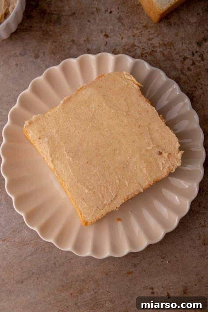 Perfect Cinnamon Sugar Toast, Every Time 8 Cinnamon sugar butter being spread onto a slice of bread.