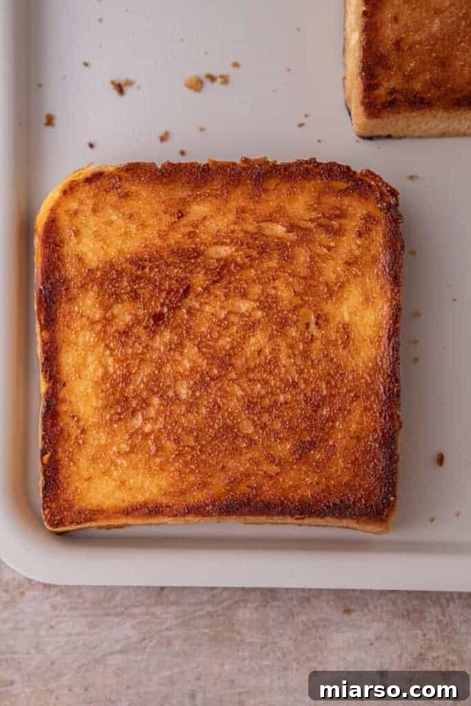 Perfect Cinnamon Sugar Toast, Every Time 9 A pan-fried slice of cinnamon sugar toast, golden brown and crispy.