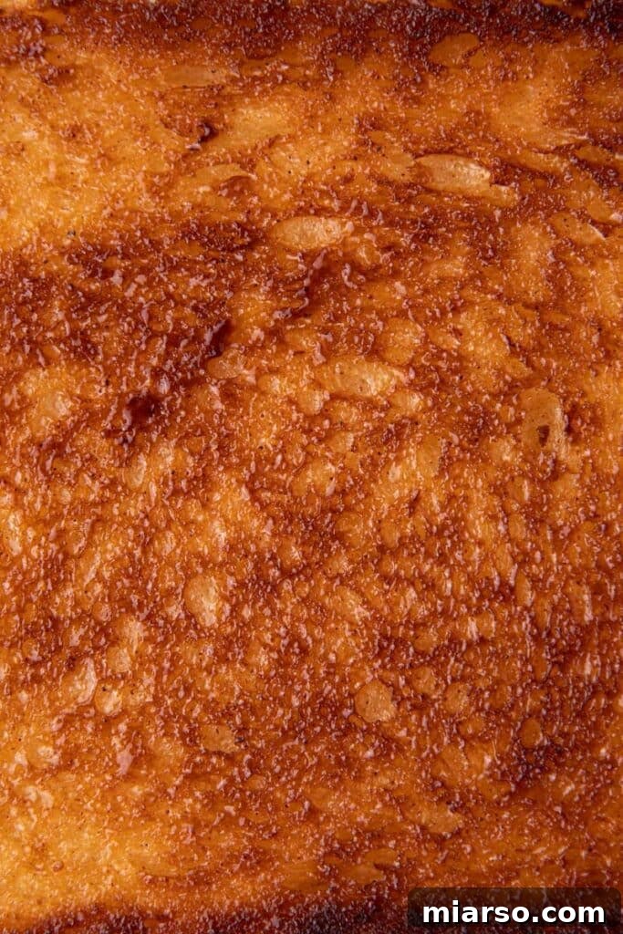 Perfect Cinnamon Sugar Toast, Every Time 10 Close-up of the surface of cinnamon sugar toast, showcasing the sugary, buttery texture.