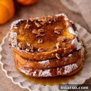Pumpkin french toast with pecans and maple syrup on top