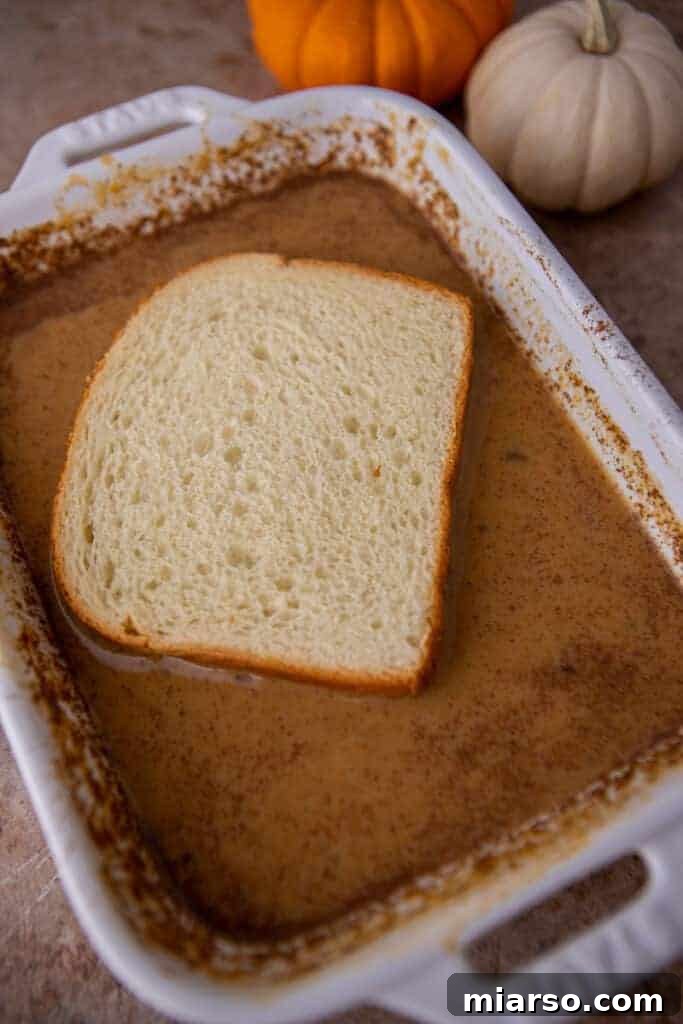 Bread soaking in pumpkin custard