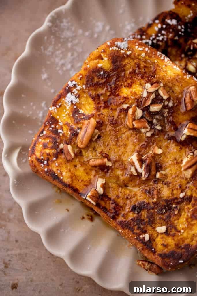 Overhead shot of pumpkin french toast with pecan and maple on top 
