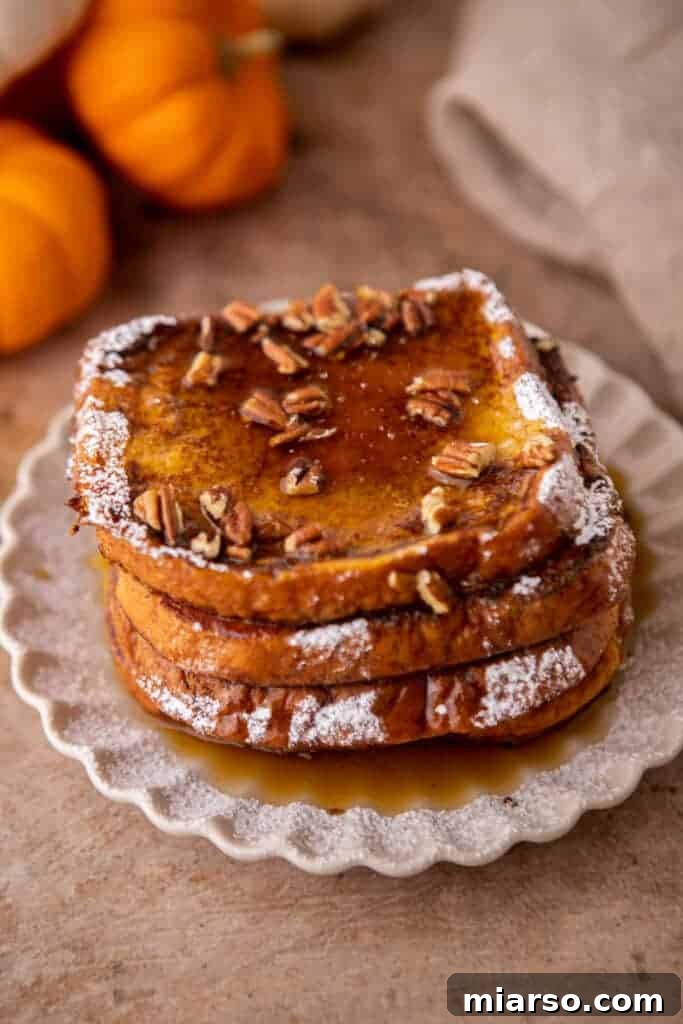 Pumpkin french toast with pecans and maple syrup on top 