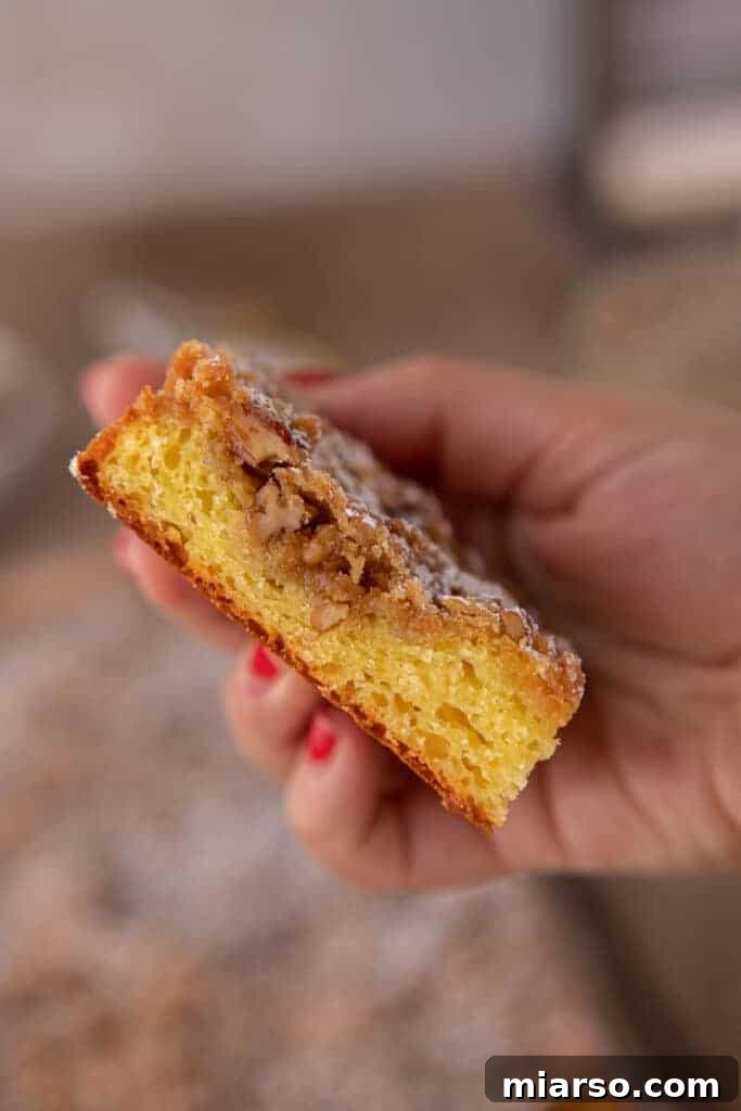 A close-up of a generous slice of cake mix coffee cake with streusel topping