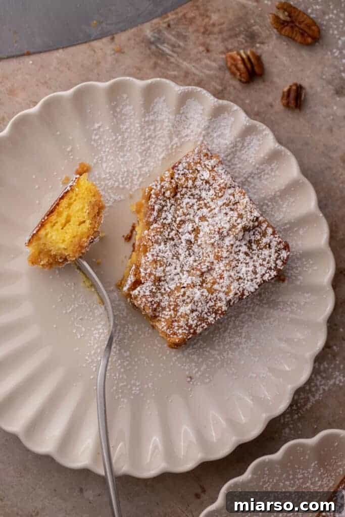 A slice of yellow cake mix coffee cake on a white plate