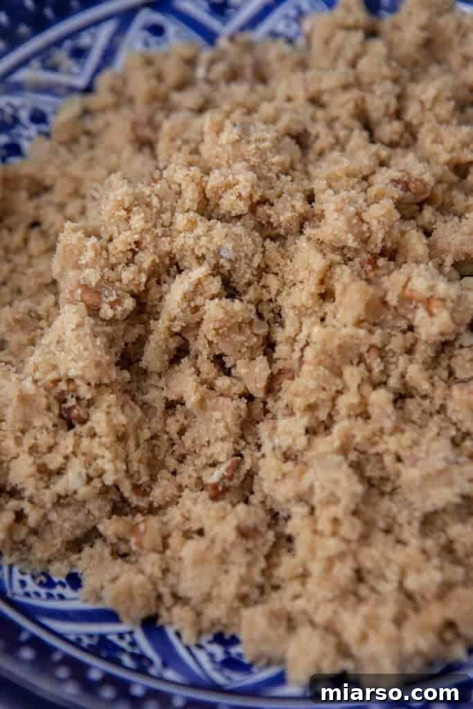 Mixing streusel topping by hand in a bowl