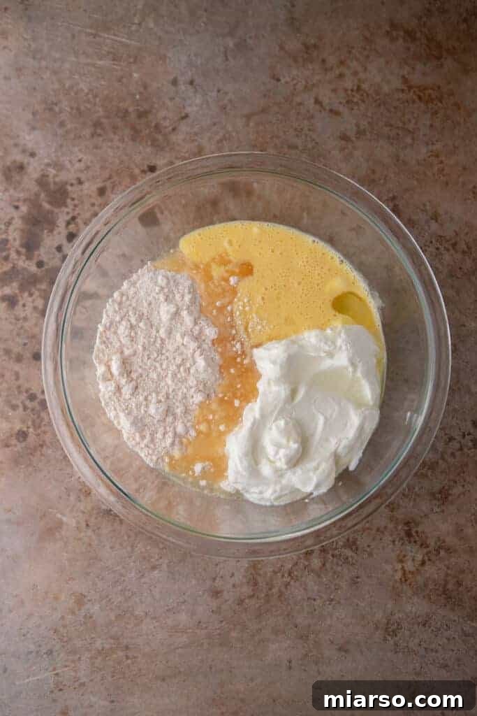 Wet ingredients for cake batter in a bowl
