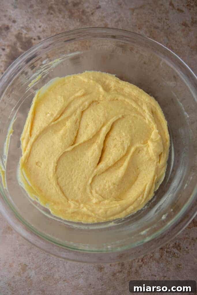 Cake batter mixture in a bowl, ready to pour