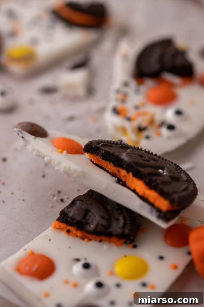 Halloween Oreo with the orange filling on white chocolate bark layer