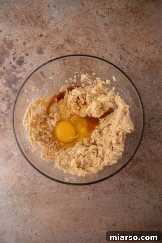 Wet ingredients for oatmeal cookies in a mixing bowl