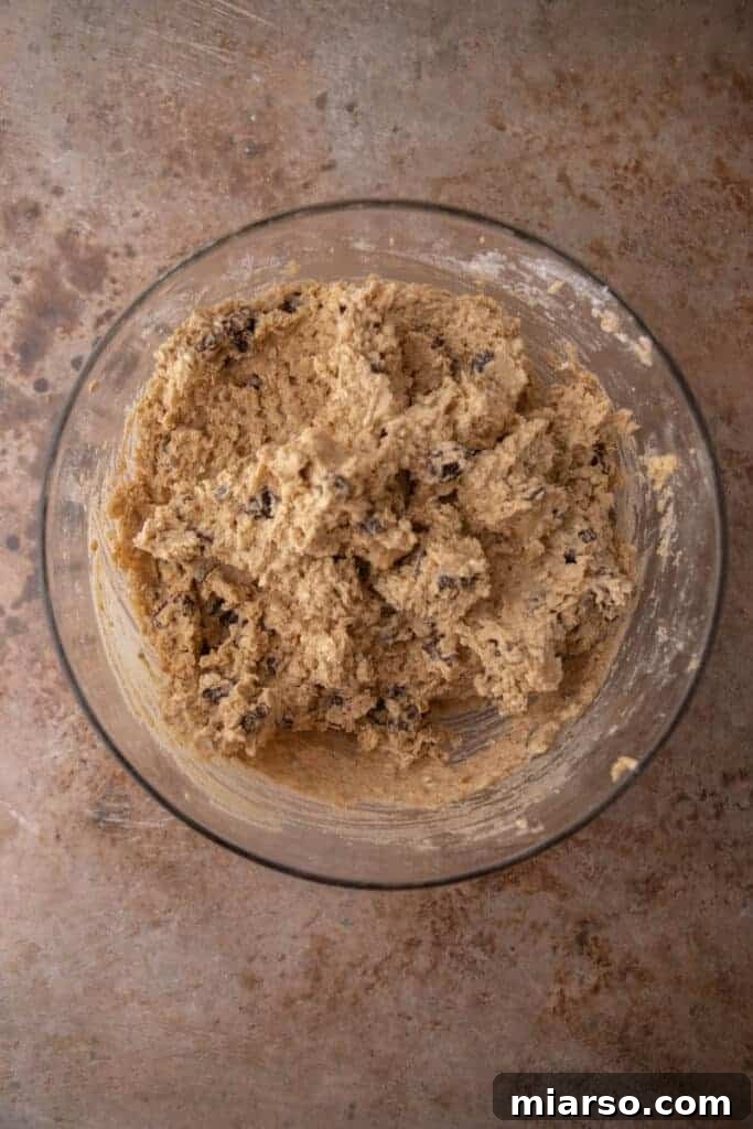 Scooping cookie dough onto a baking sheet