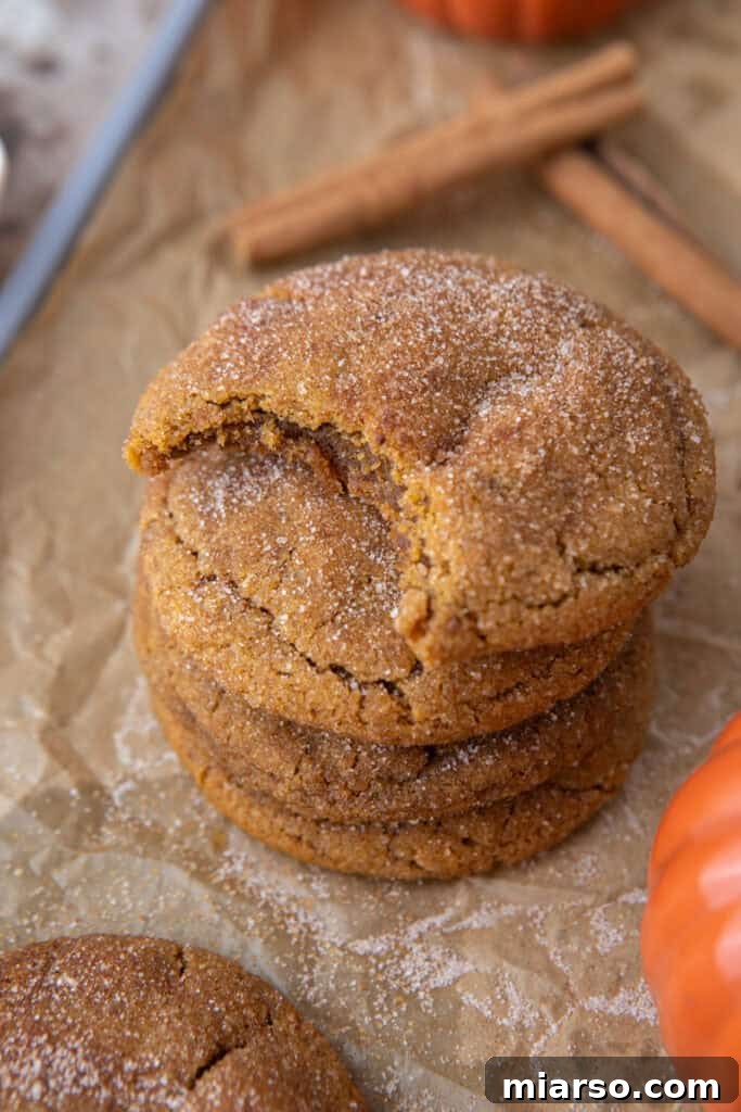 Stacked Brown Butter Pumpkin Snickerdoodle Cookies, showing their perfectly chewy texture and cinnamon-sugar coating