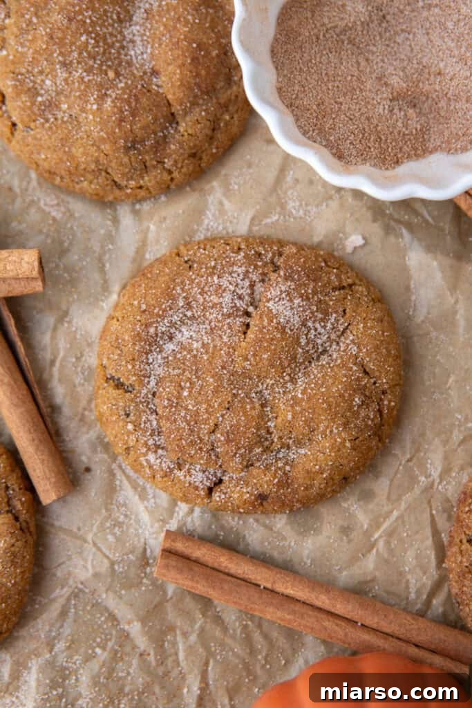 Freshly baked Brown Butter Pumpkin Snickerdoodles on a baking sheet