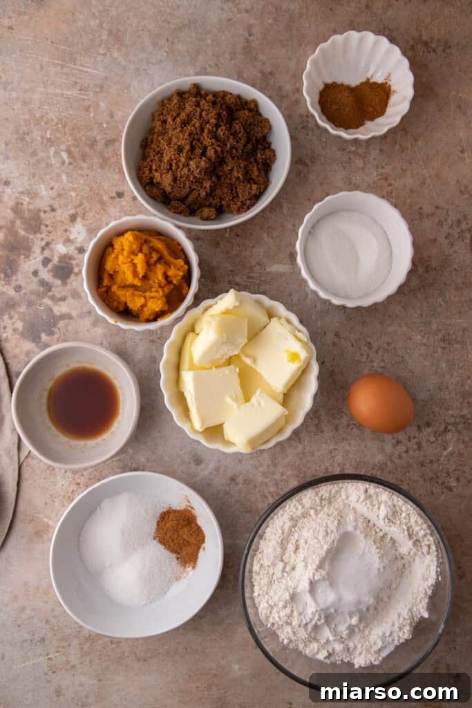 Ingredients for Brown Butter Pumpkin Snickerdoodle Cookies laid out on a table