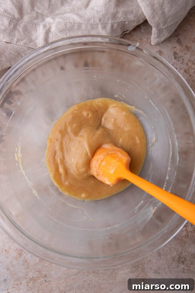 Wet ingredients for Brown Butter Pumpkin Snickerdoodle Cookies in a bowl