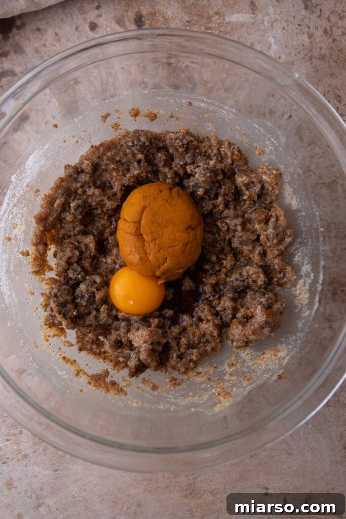 Combined wet ingredients for Brown Butter Pumpkin Snickerdoodle Cookies