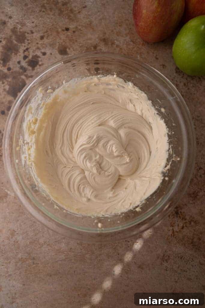 Creamy cheesecake mixture in a bowl after being perfectly blended, smooth and fluffy.