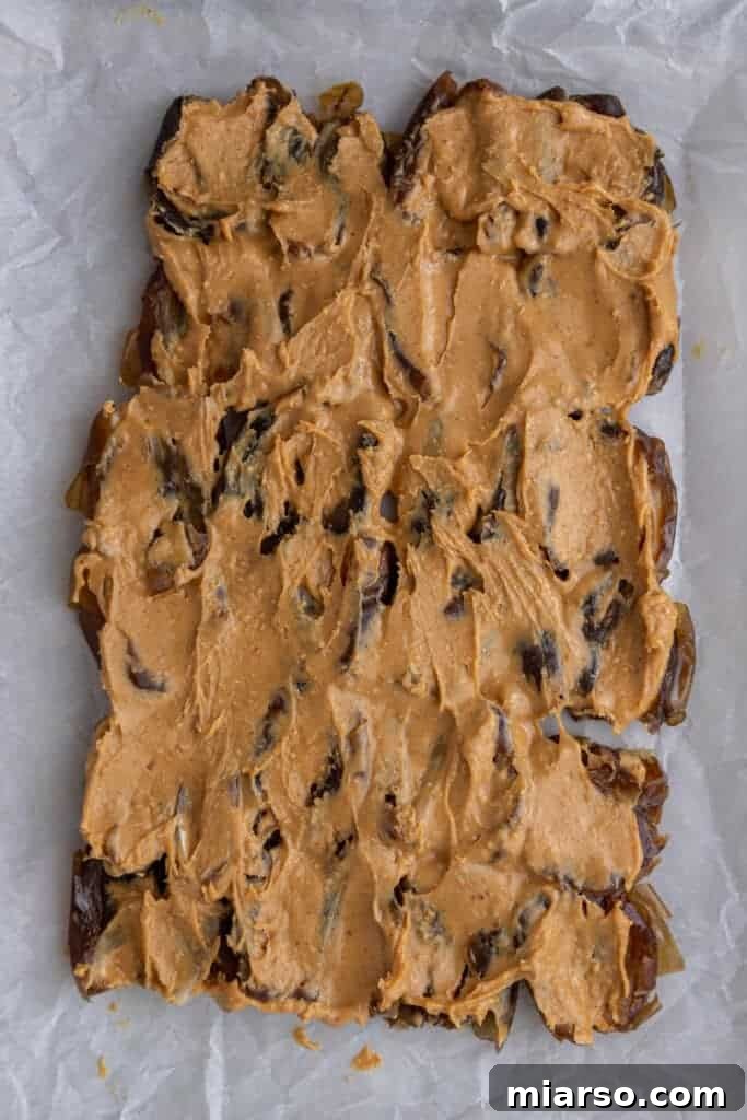 Dates with peanut butter spread evenly