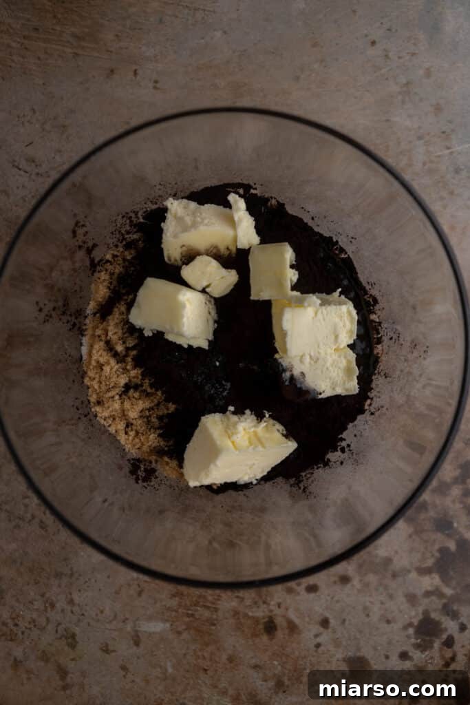 Butter, sugar and cocoa powder in a bowl