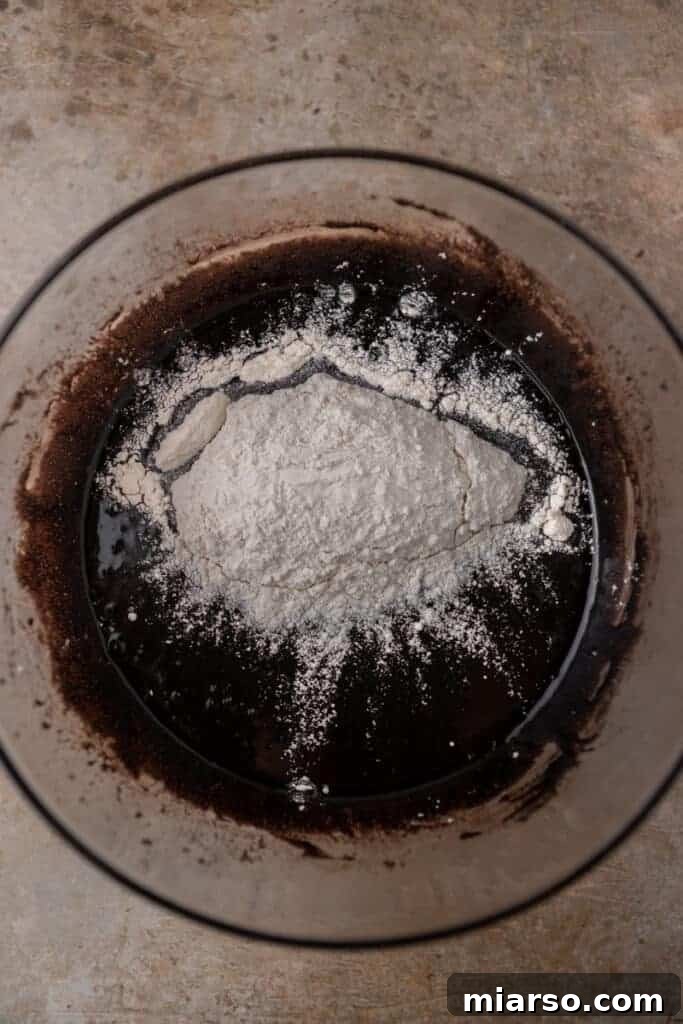chocolate batter with flour on top