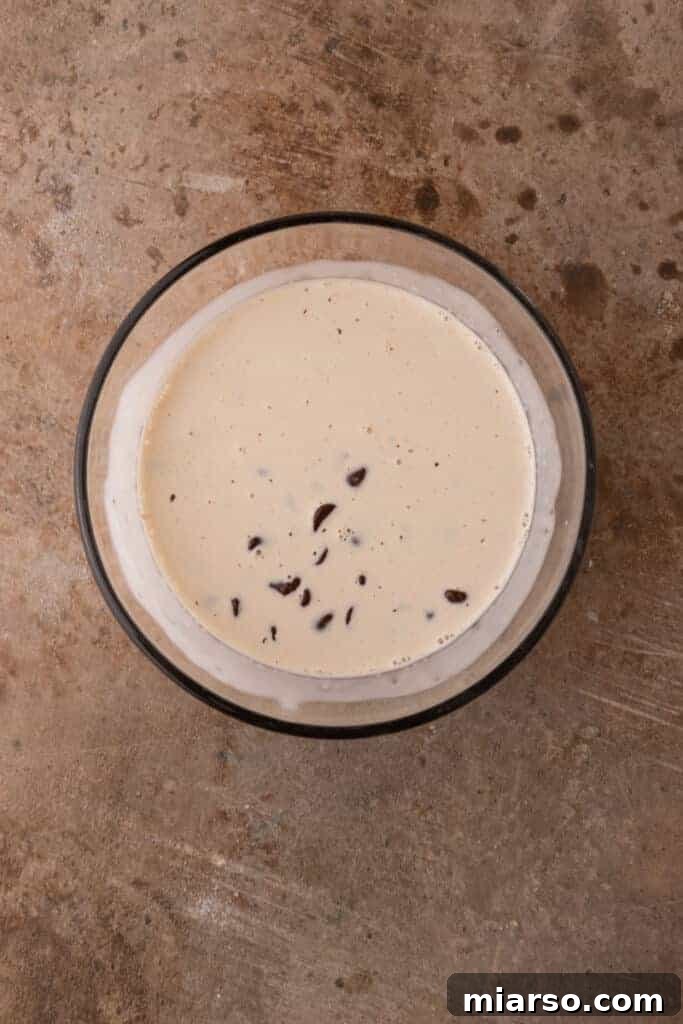 Chocolate chips and heavy cream for ganache in a bowl