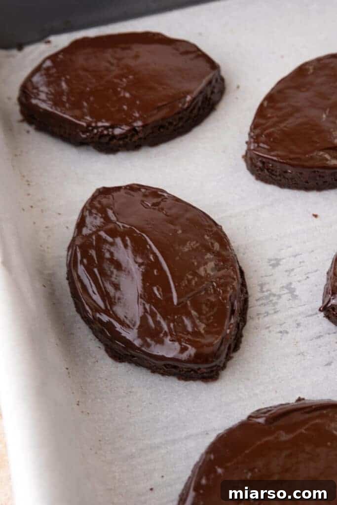 Football-shaped brownies with chocolate ganache frosting on top
