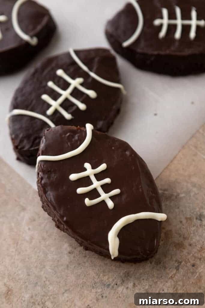 Finished football brownies with white chocolate lace designs