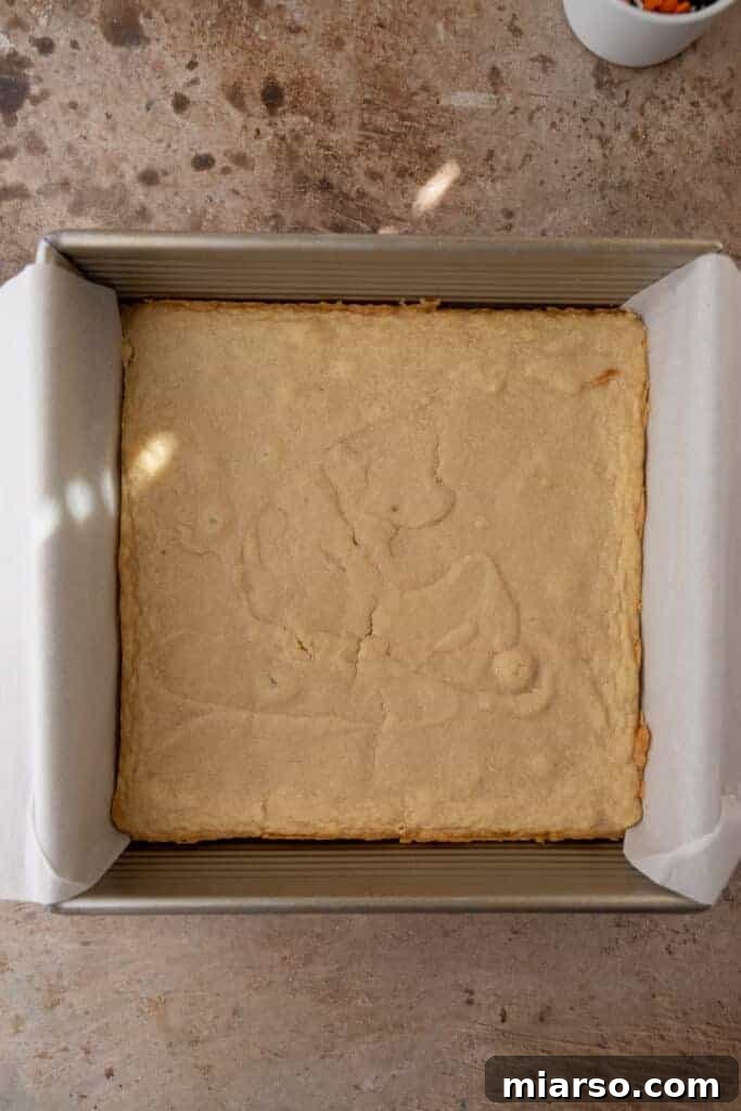 Spooktacularly Simple Halloween Sugar Cookie Bars 8 Sugar cookie bars baking in a pan