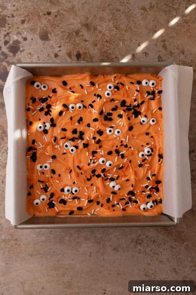 Spooktacularly Simple Halloween Sugar Cookie Bars 9 Halloween monster sugar cookie bars decorated with candy eyeballs