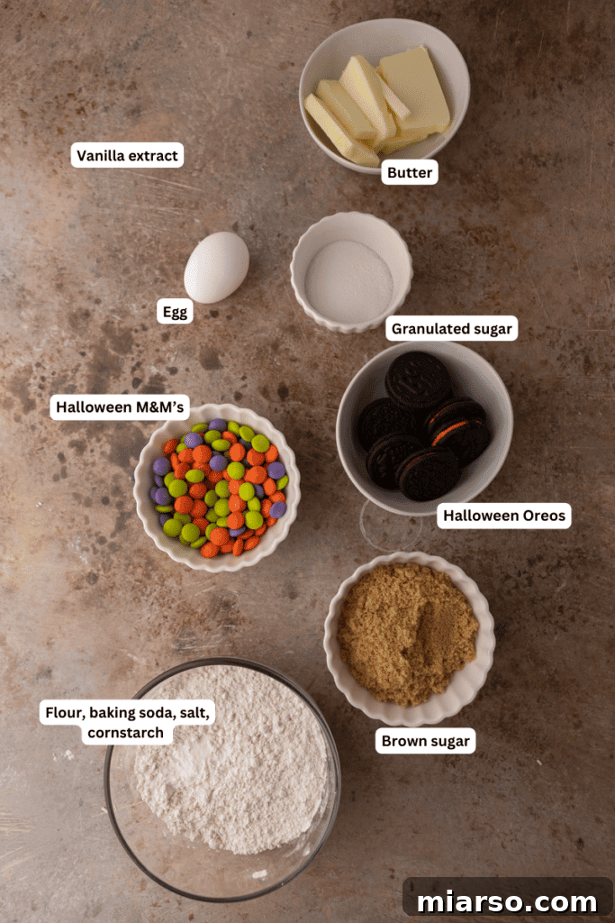 Ingredients for Halloween Oreo M&M's cookies laid out on a counter