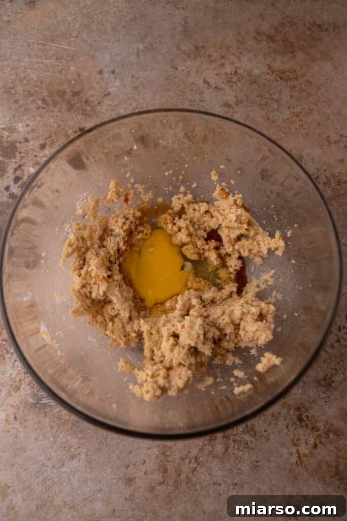 Wet ingredients for Halloween Oreo M&M's cookies in a bowl