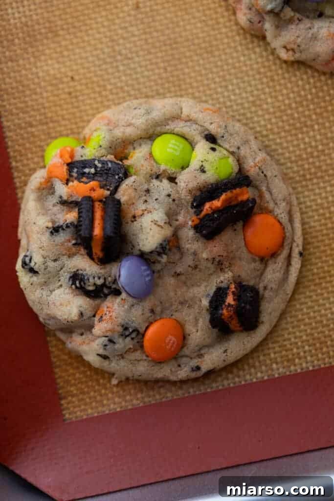 Baked Halloween Oreo M&M's cookies cooling