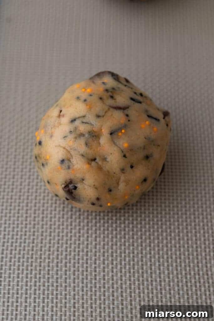 raw cookie dough completely wrapped around an Oreo cookie