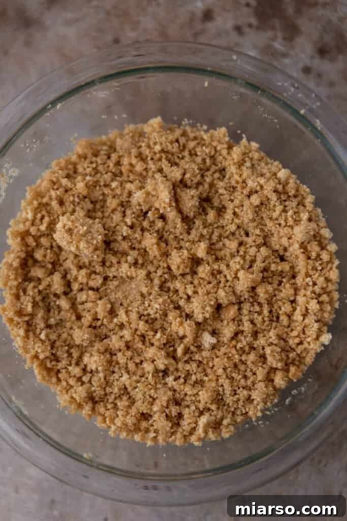 Graham cracker crust mixture in a bowl