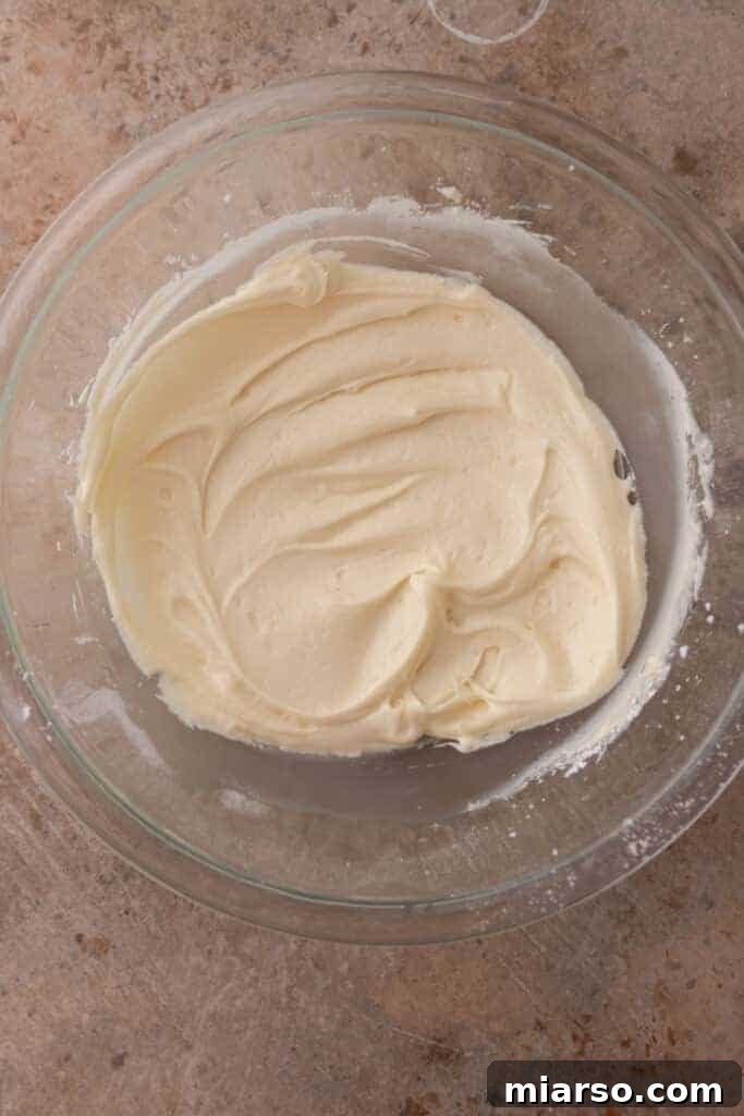 Smooth and fluffy eggnog frosting in a bowl