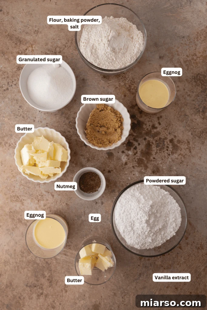Baking ingredients including butter, sugar, eggs, and eggnog on a kitchen counter
