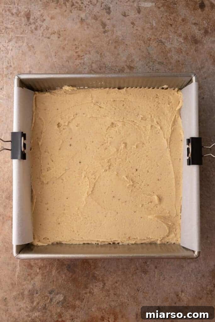 Eggnog cookie dough pressed into a baking pan