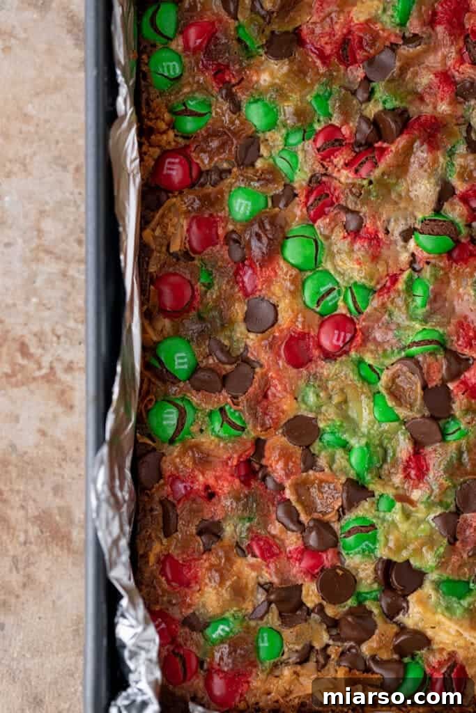 Fully baked Christmas magic cookie bars in a pan, golden and delicious