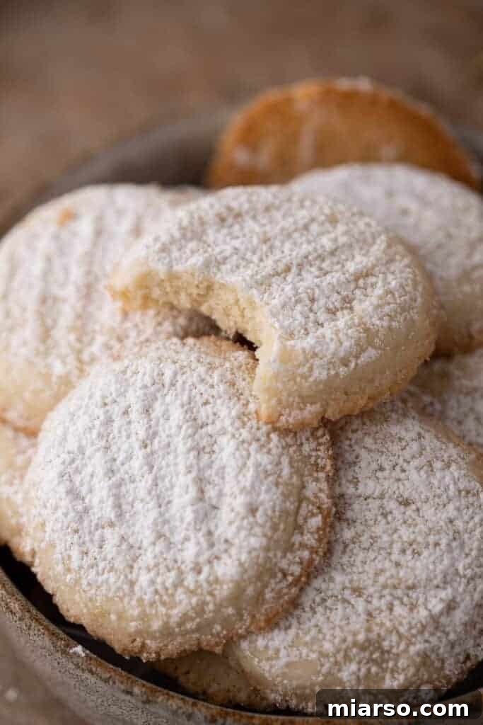 close up of a loosely piled group of cornstarch cookies