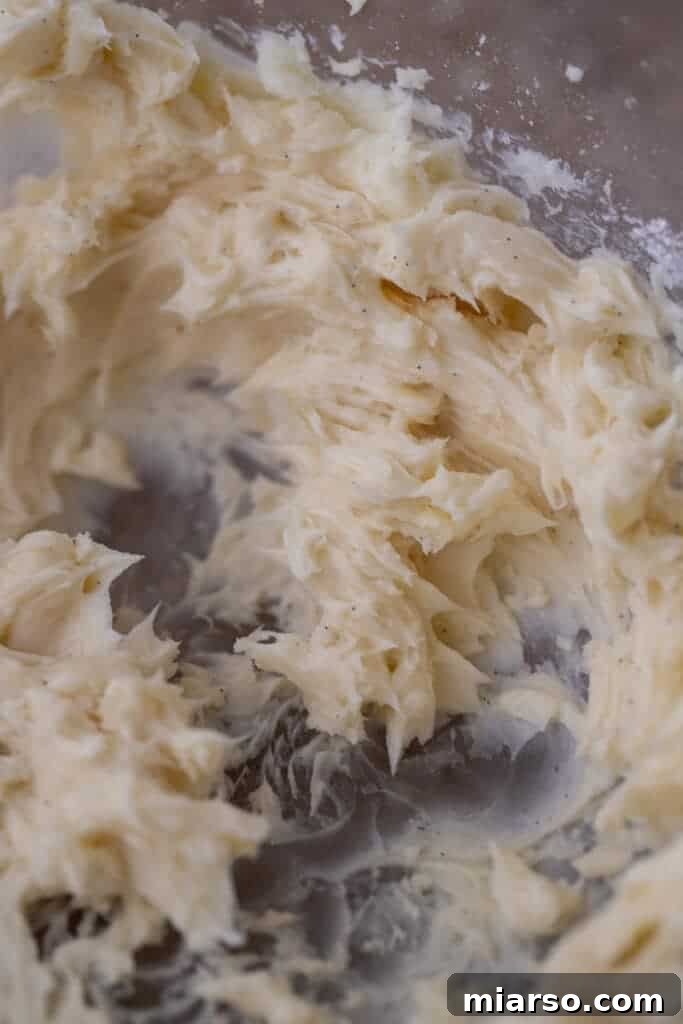raw ingredients of melting moments cookies beginning to be mixed in a bowl