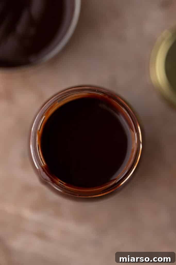 Ultimate Homemade Mocha Coffee Syrup 8 Overhead shot of a jar filled with rich homemade mocha coffee syrup, ready for use.