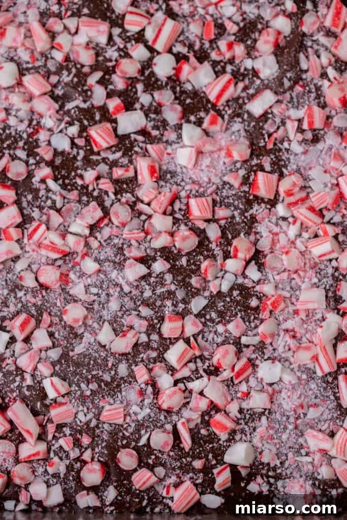 Finished and cooled peppermint fudge recipe, neatly cut into squares in the pan.