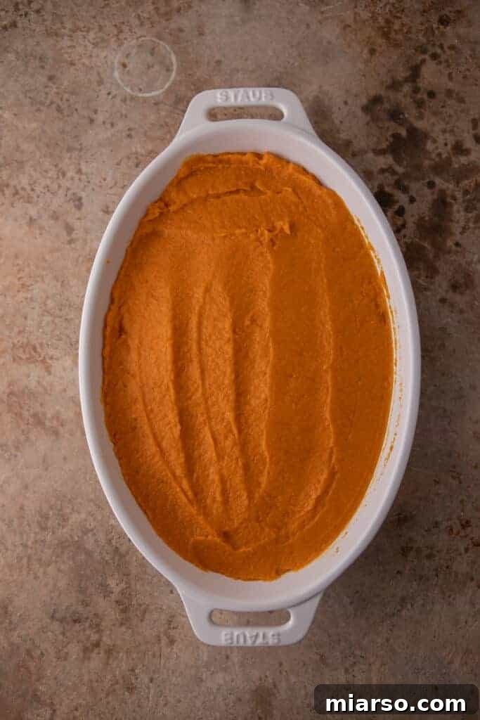 Pecan-Topped Sweet Potato Perfection 11 sweet potato in a nice pan without the pecan topping yet