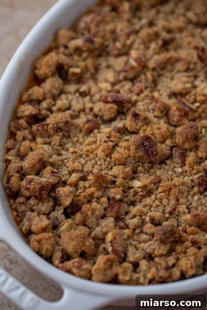 Pecan-Topped Sweet Potato Perfection 15 close up shot of the sweet potato casserole with pecan topping