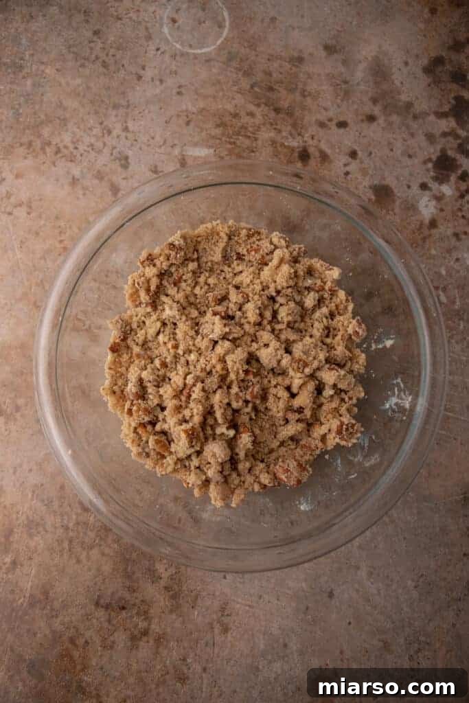Pecan-Topped Sweet Potato Perfection 7 mixed topping ingredients in a bowl
