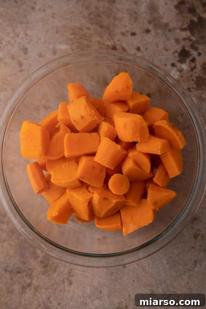Pecan-Topped Sweet Potato Perfection 8 fully boiled potato in a bowl